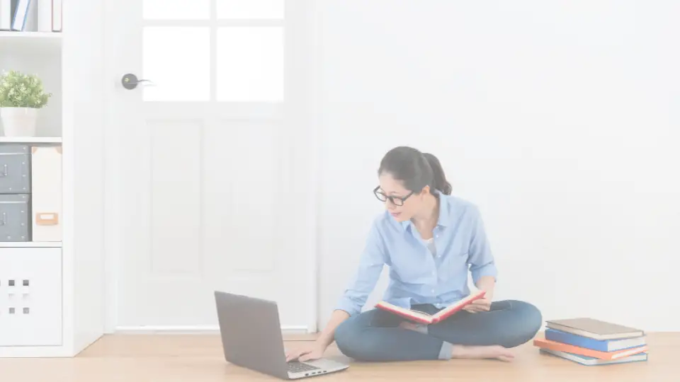 A homeschooling mom putting grades in the computer.